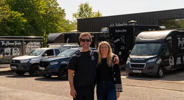 The Flavour Trailer couple in front of the growing fleet